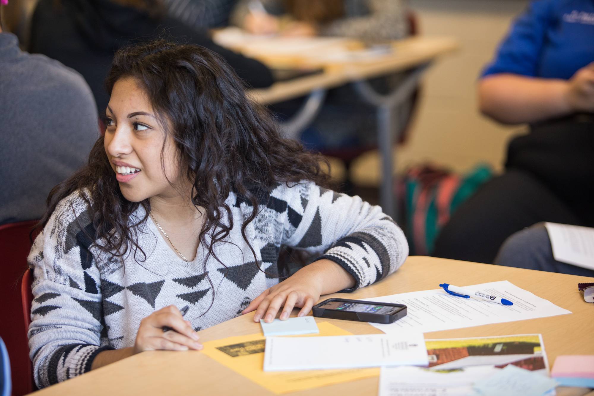 A student at Holland High sitting at a table